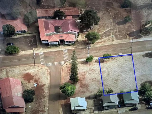 an aerial view of a houses with yard