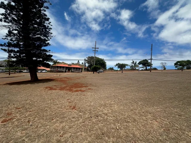 a view of street with parked cars