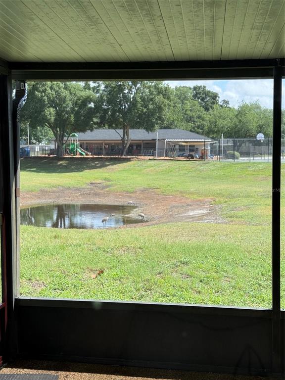 1636 Baker Road Lutz, FL 33559 - Photo 12 of 13 a view of a big yard with an outdoor space