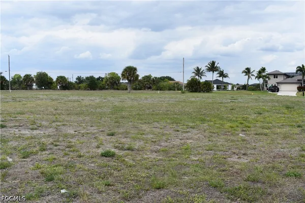 a view of a field with houses