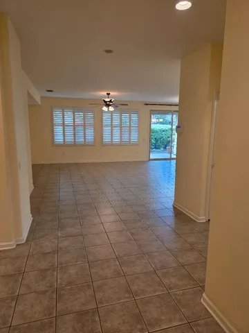 a view of hallway with windows