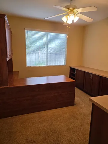 a bathroom with a bathtub and a chandelier