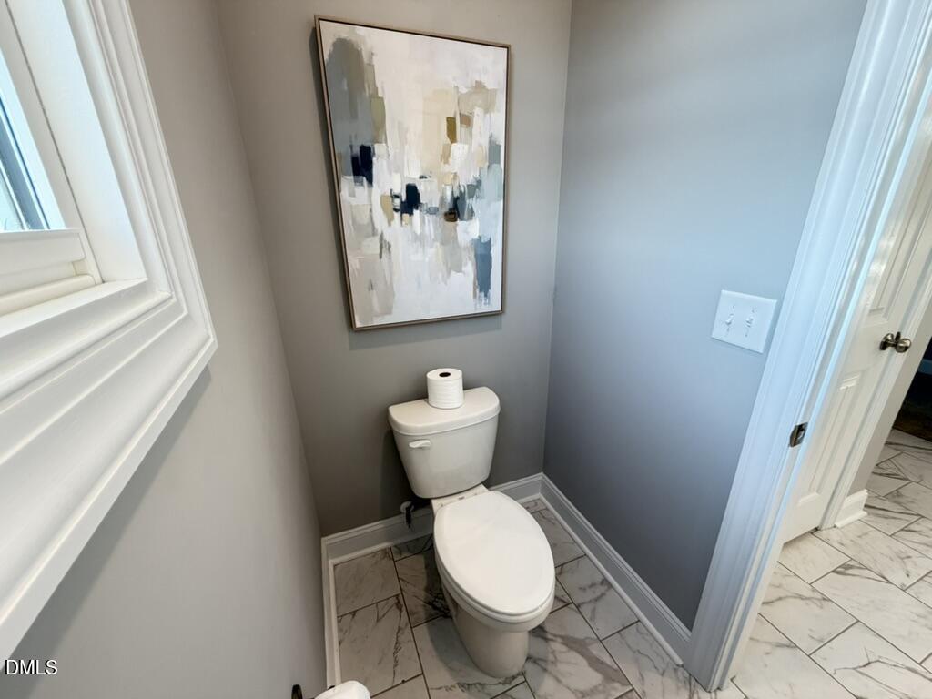 88 Heath Road Lillington, NC 27546 - Photo 14 of 54 a bathroom with a toilet and a sink