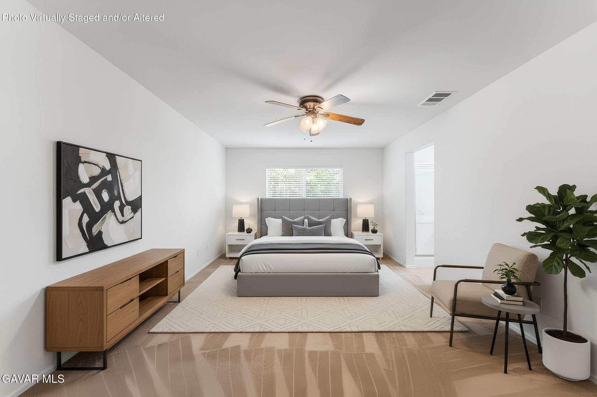 45334 Stadium Lane Lancaster, CA 93535 - Photo 12 of 36 a bedroom with a bed and a chandelier
