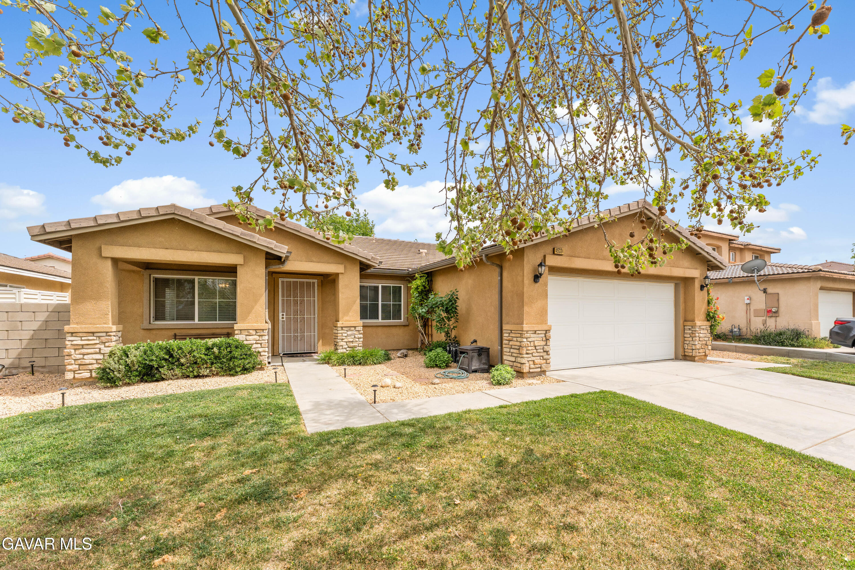 45334 Stadium Lane Lancaster, CA 93535 - Photo 2 of 36 a front view of a house with yard and seating space