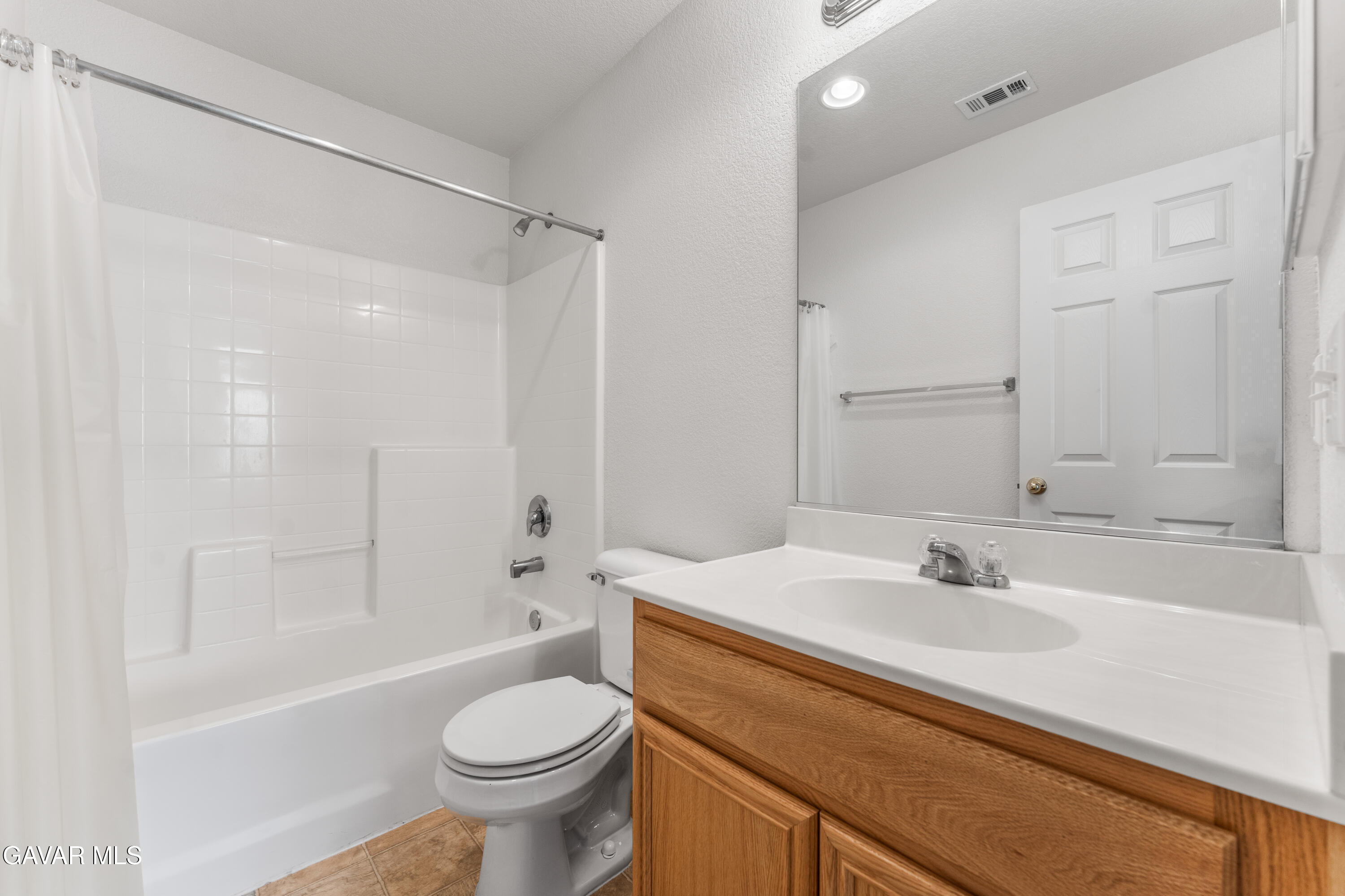 45334 Stadium Lane Lancaster, CA 93535 - Photo 23 of 36 a bathroom with a sink toilet and shower