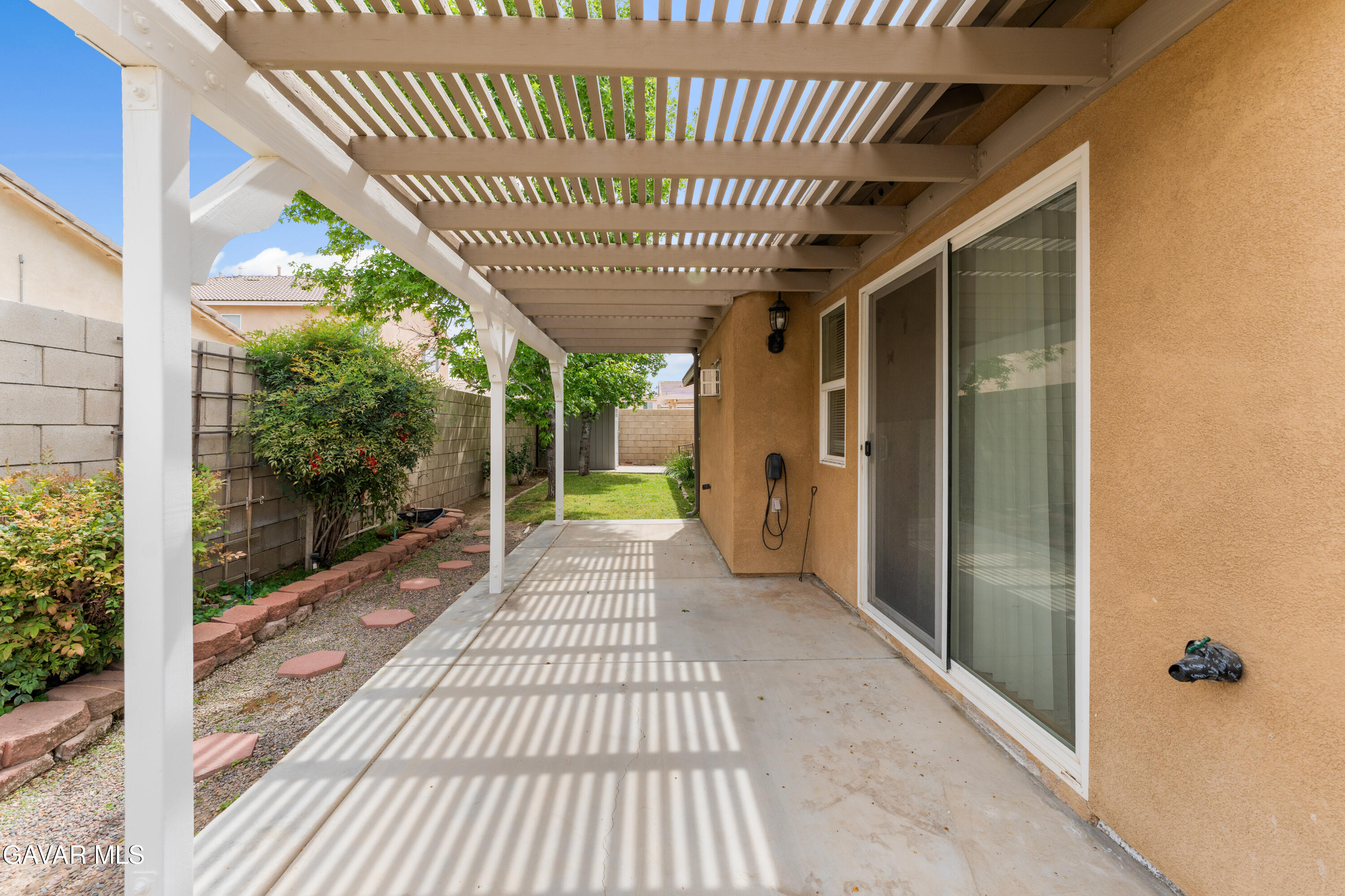 45334 Stadium Lane Lancaster, CA 93535 - Photo 29 of 36 a view of a porch with wooden floor and outdoor space