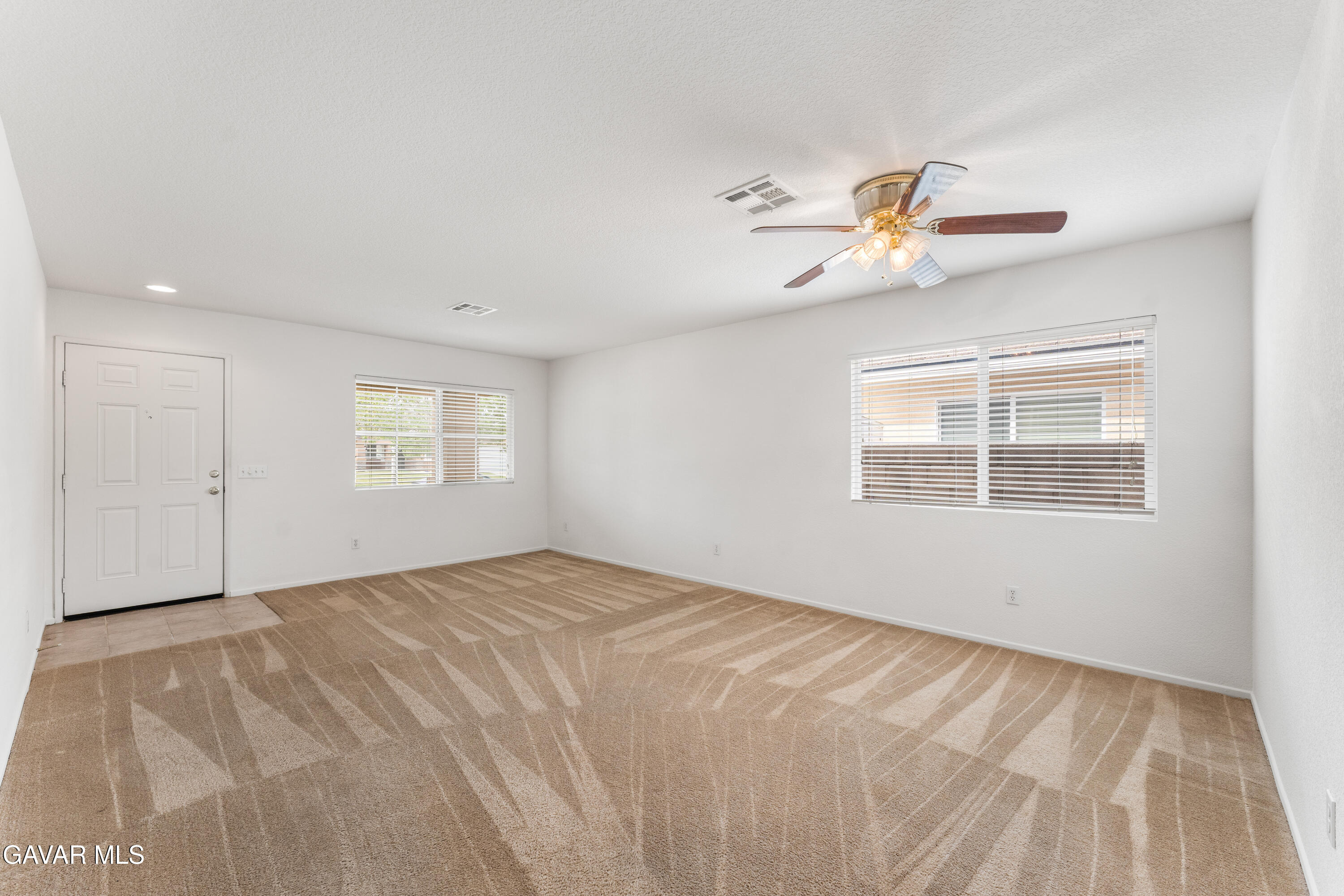 45334 Stadium Lane Lancaster, CA 93535 - Photo 4 of 36 a view of an empty room with a window