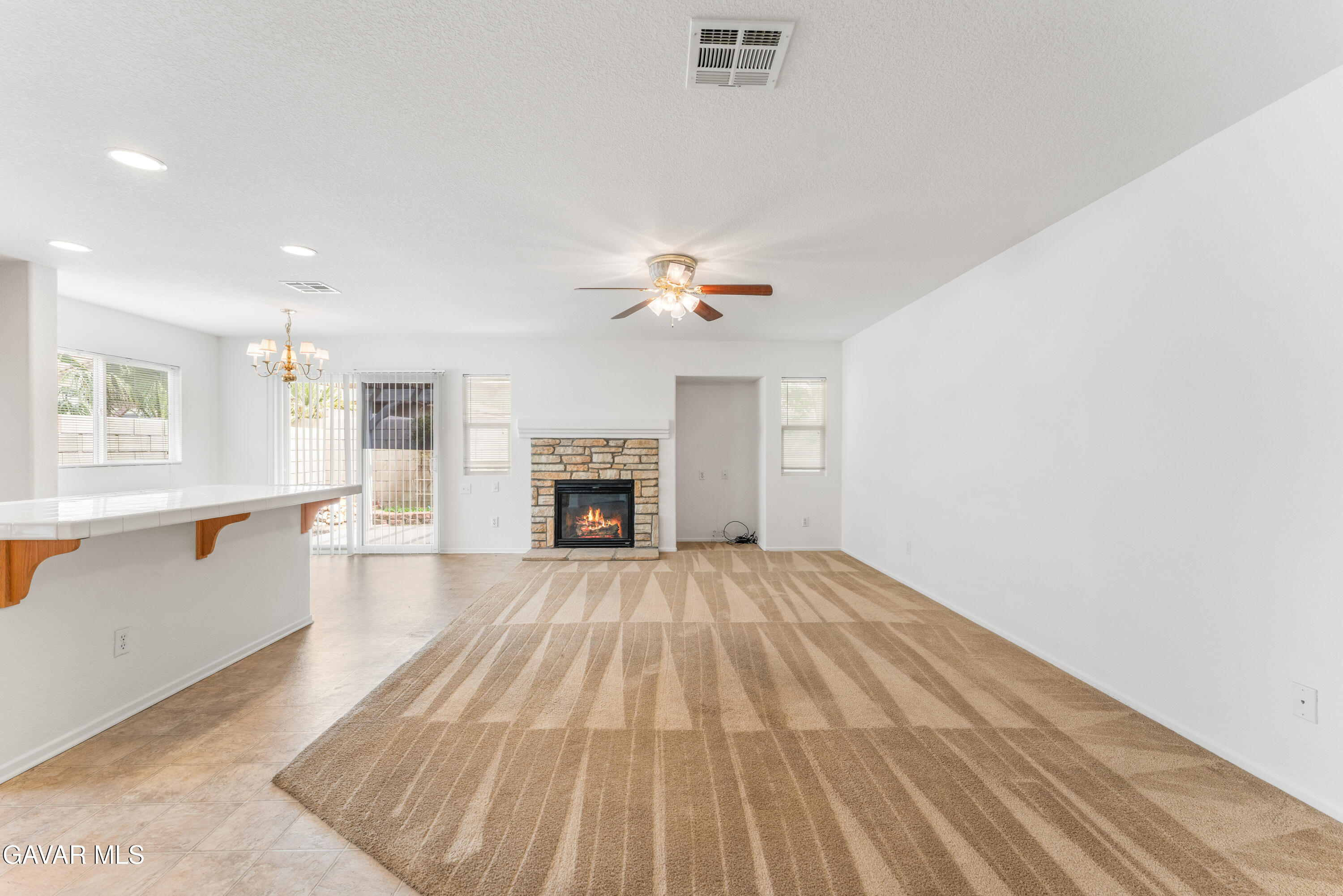 45334 Stadium Lane Lancaster, CA 93535 - Photo 7 of 36 a view of a livingroom with a fireplace