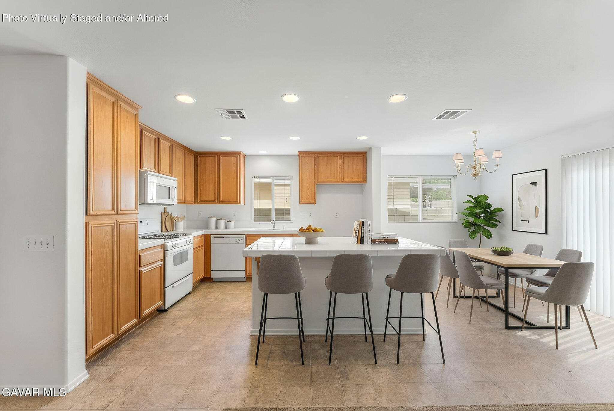 45334 Stadium Lane Lancaster, CA 93535 - Photo 8 of 36 a kitchen with a table and chairs in it