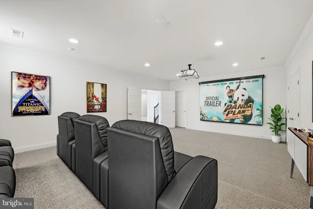 a hallway with a couch and a painting with potted plant