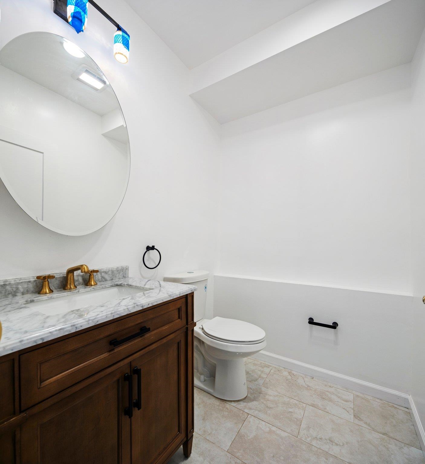 30 Wilkinson Avenue, Unit 1 Jersey City, NJ 07305 - Photo 14 of 17 a bathroom with a granite countertop sink and a mirror