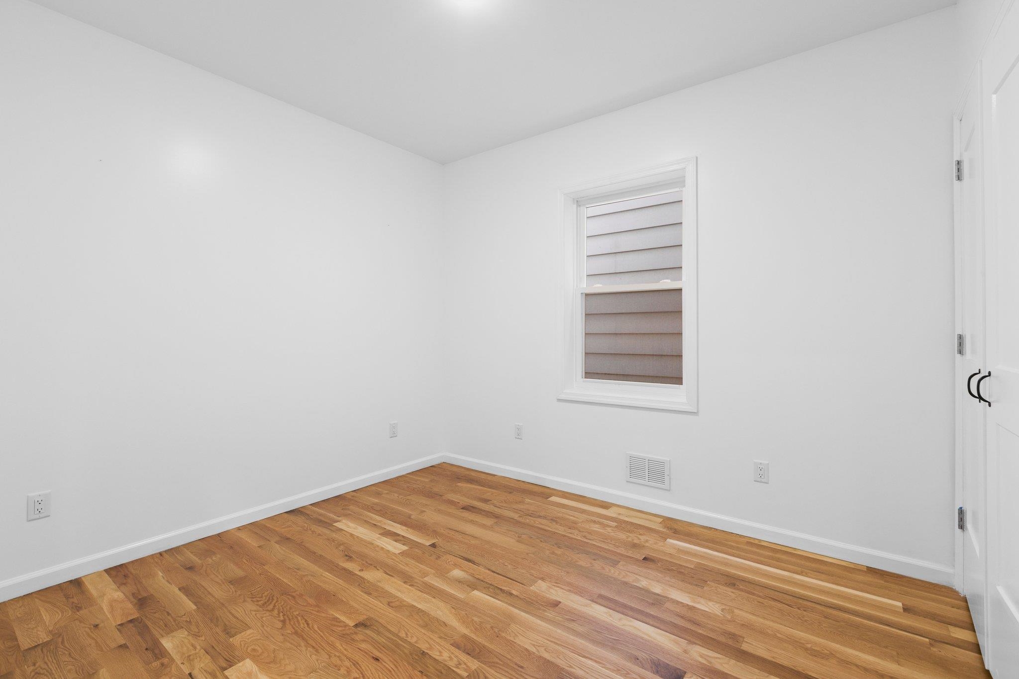 30 Wilkinson Avenue, Unit 1 Jersey City, NJ 07305 - Photo 9 of 17 a view of a room that has a window in it