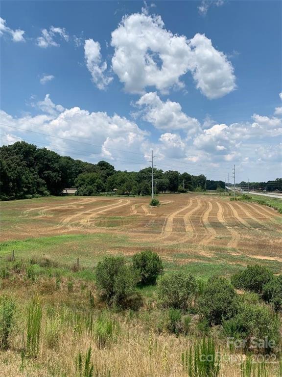 2914 Heath Davis Road Monroe, NC 28110 - Photo 2 of 6 a view of a lake from a yard