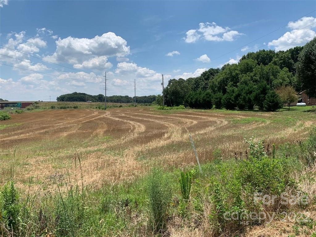 2914 Heath Davis Road Monroe, NC 28110 - Photo 6 of 6 a view of a lake and a yard