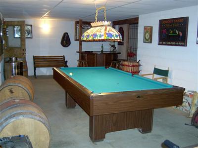 23229 Walling Road Geyserville, CA 95441 - Photo 8 of 8 a living room with pool table and a flat screen tv