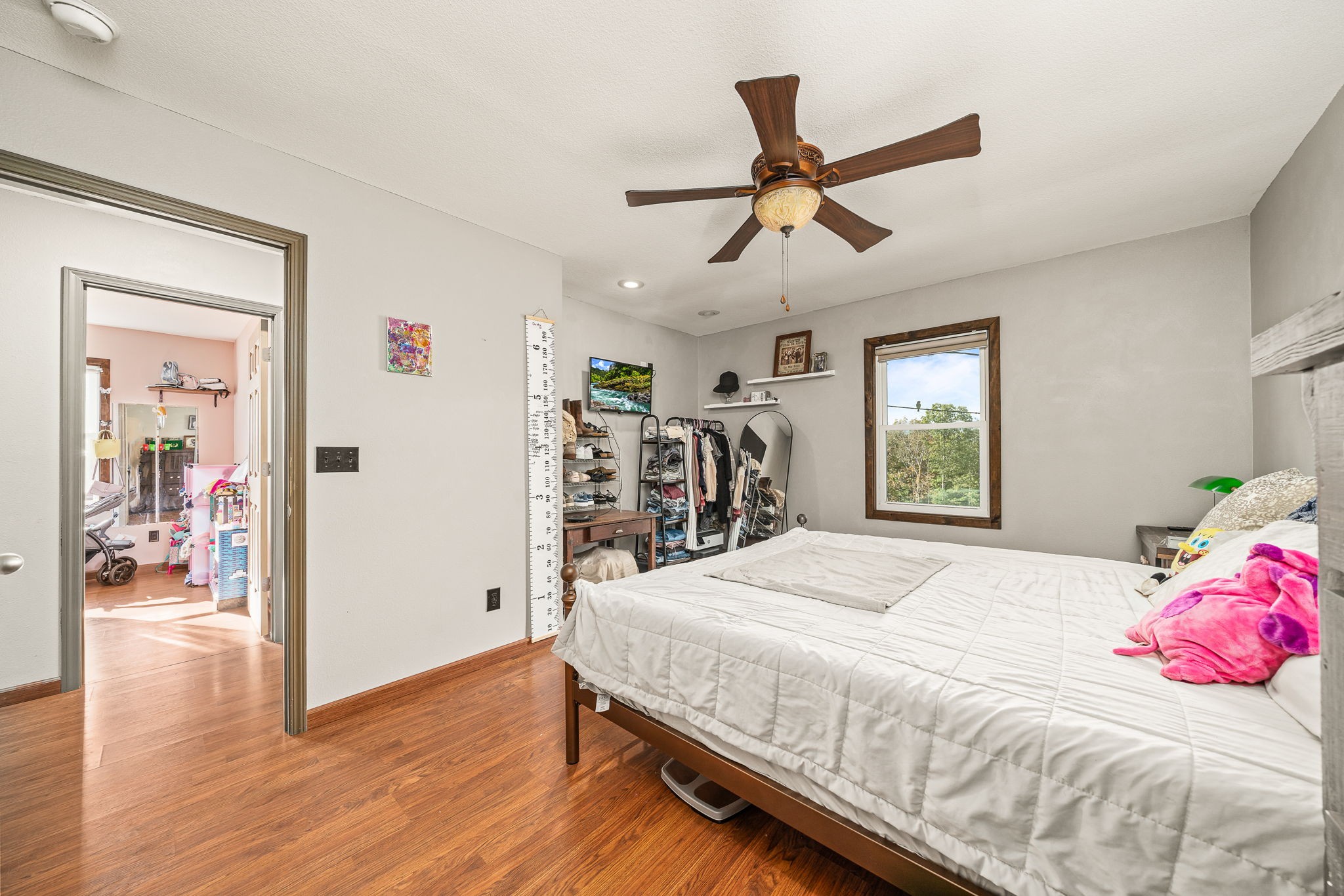 944 Flat Rock Road Crossville, TN 38572 - Photo 13 of 51 a bedroom with a bed and a chandelier
