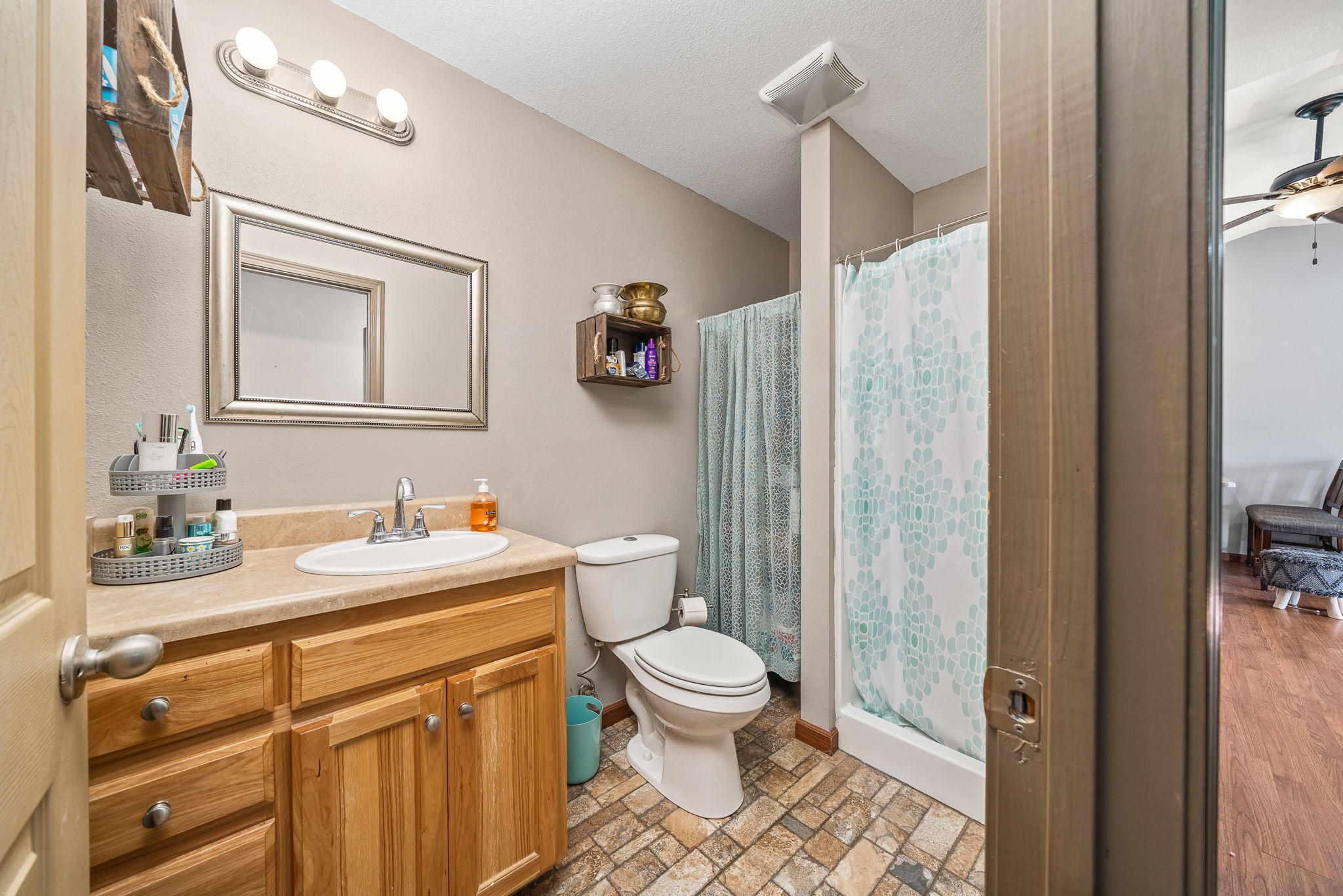 944 Flat Rock Road Crossville, TN 38572 - Photo 19 of 51 a bathroom with a granite countertop sink toilet and shower