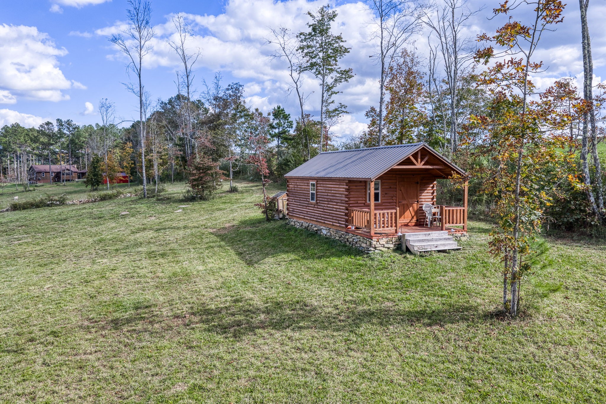 944 Flat Rock Road Crossville, TN 38572 - Photo 33 of 51 a backyard of a house with table and chairs