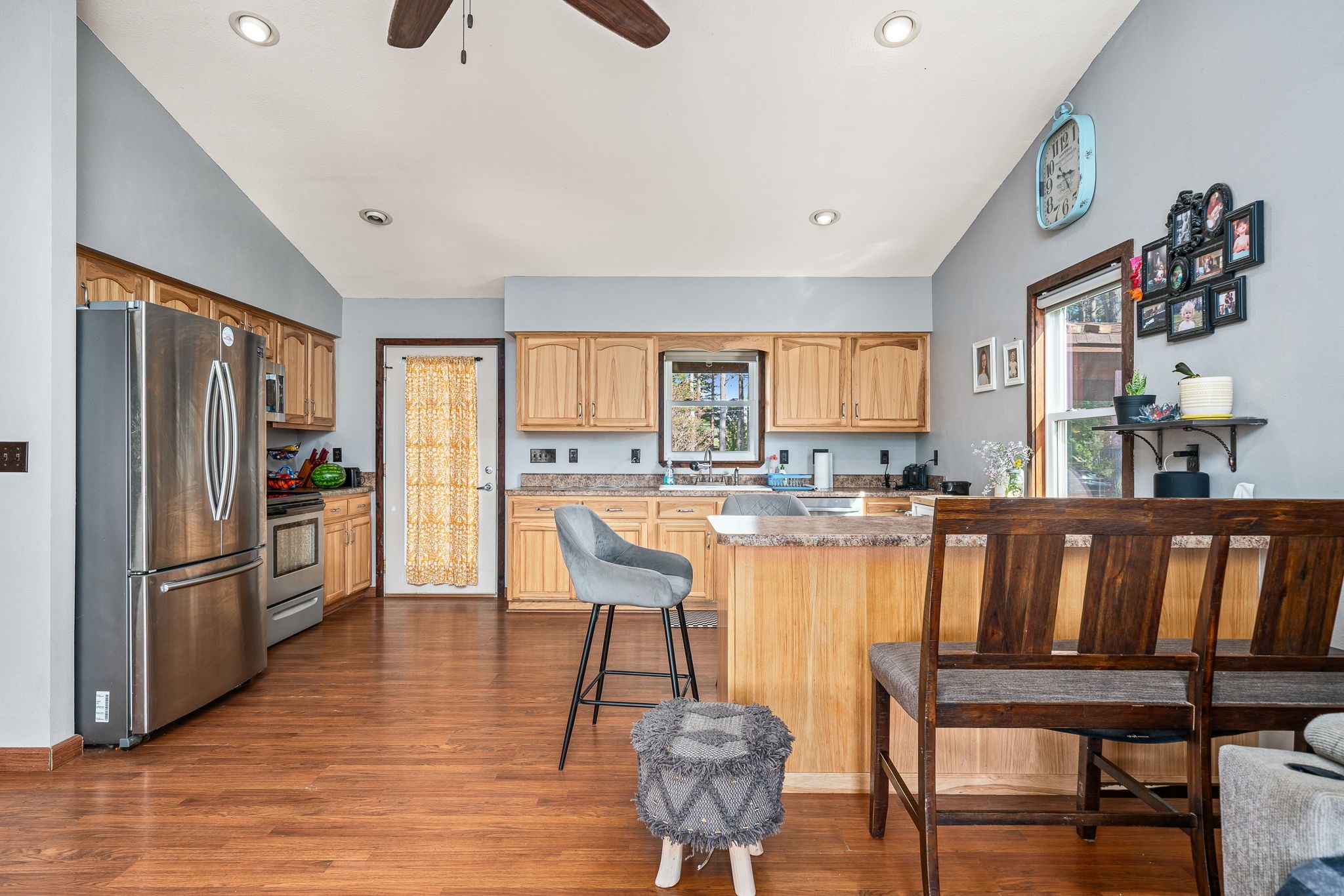 944 Flat Rock Road Crossville, TN 38572 - Photo 7 of 51 a kitchen with stainless steel appliances wooden floor and chair