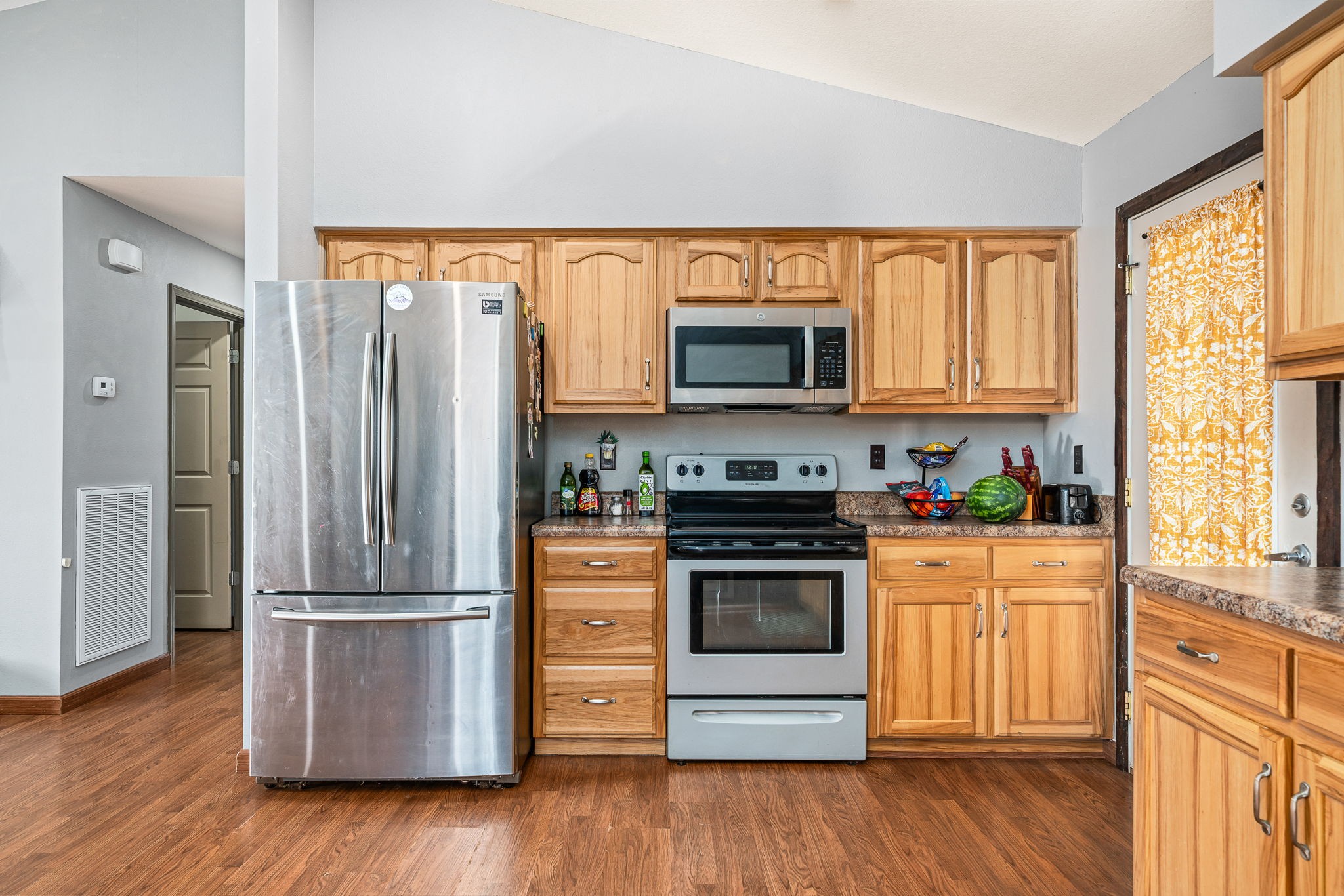 944 Flat Rock Road Crossville, TN 38572 - Photo 8 of 51 a kitchen with stainless steel appliances a stove a microwave and a refrigerator