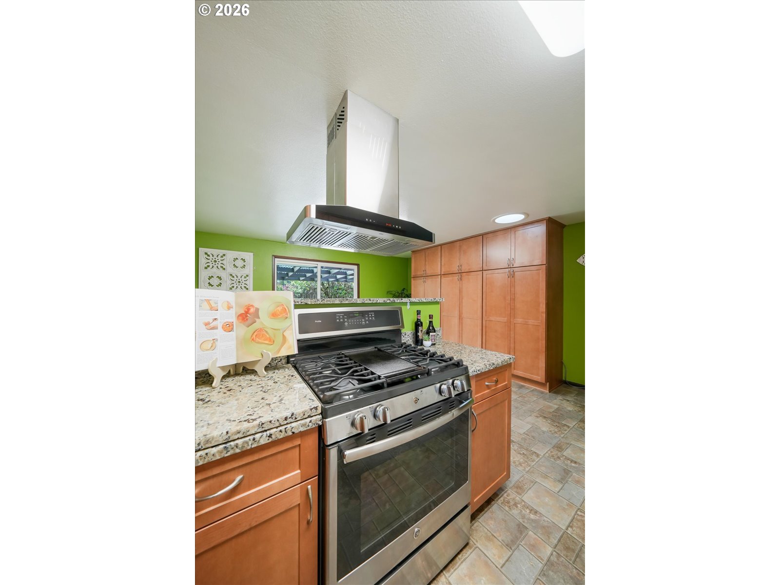 2035 Primrose Loop Philomath, OR 97370 - Photo 38 of 48 a kitchen with stainless steel appliances granite countertop a stove and a microwave