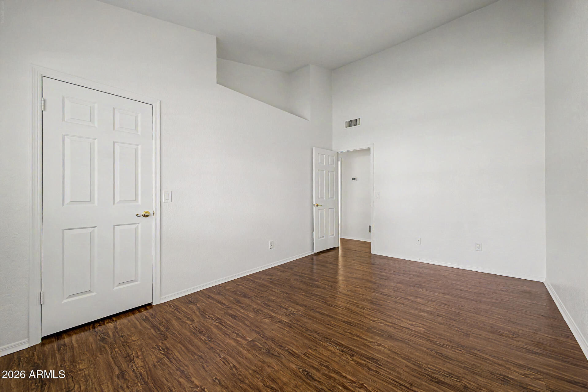 6725 West Utopia Road Glendale, AZ 85308 - Photo 18 of 27 a view of an empty room with wooden floor