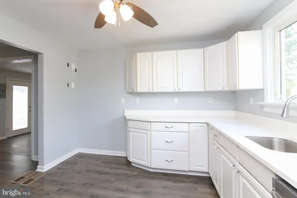 a view of washer and dryer with wooden floor