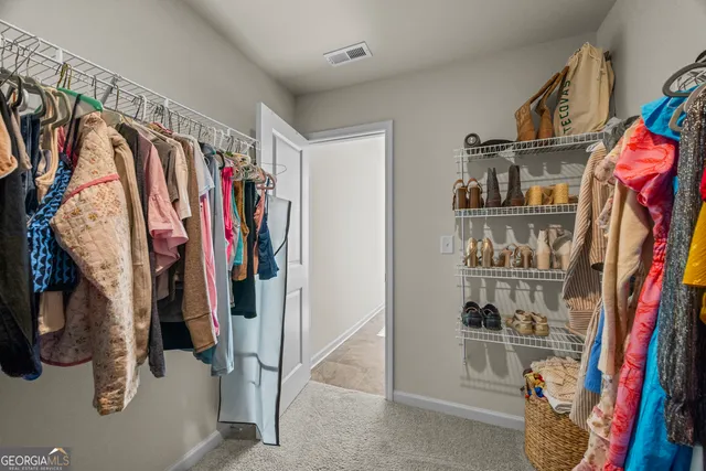 a view of a patio with a chairs and table in the patio