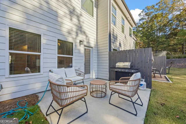 a view of a yard with yellow house