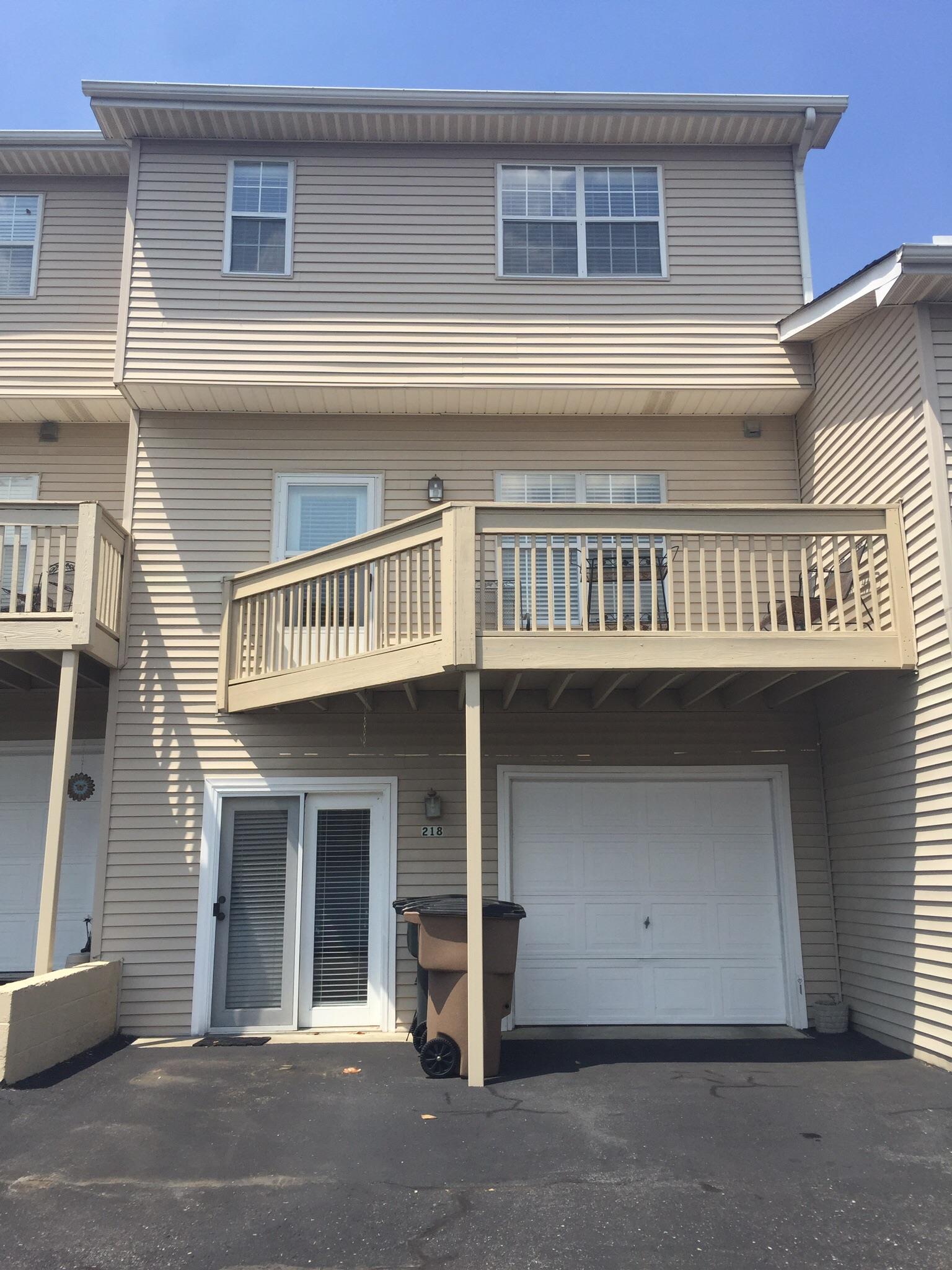218 Pepper Ridge Circle, Unit 218 Antioch, TN 37013 - Photo 1 of 22 Back view of your home... With 1 car garage and new door remote. Pedestrian door leading into the Rec room / Office area