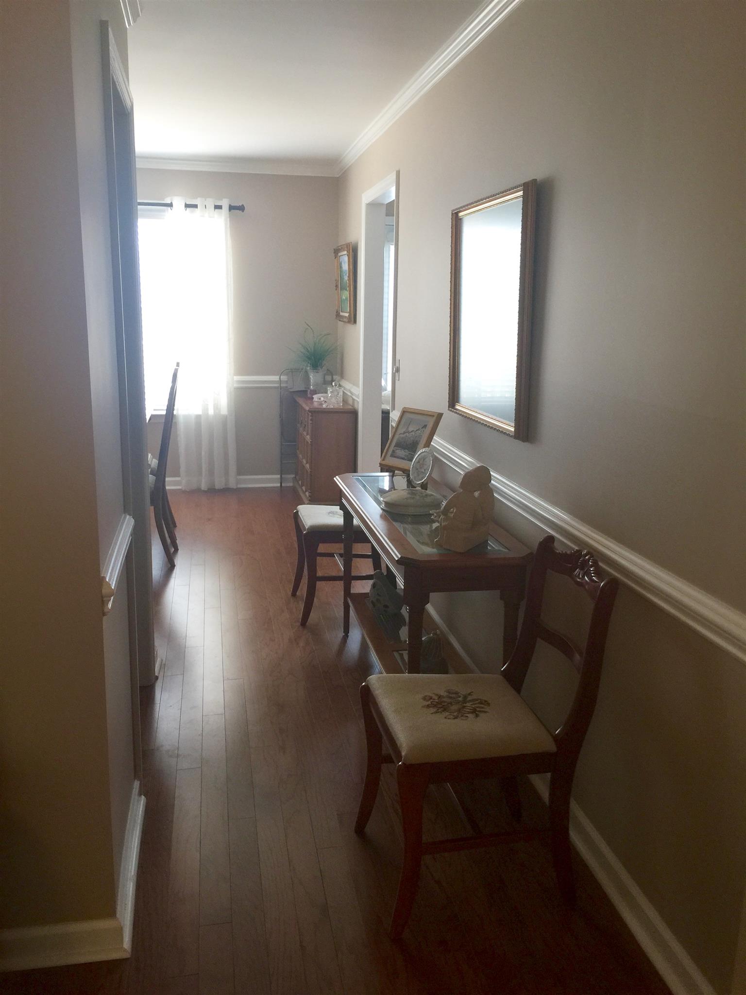 218 Pepper Ridge Circle, Unit 218 Antioch, TN 37013 - Photo 4 of 22 Hallway leading into your DR. Notice the beautiful Hardwoods .