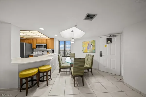 a room with dining table and chairs