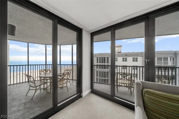 a view of a porch with a furniture