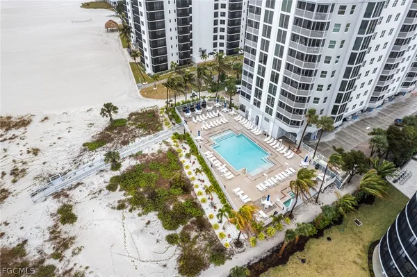a view of swimming pool with outdoor seating