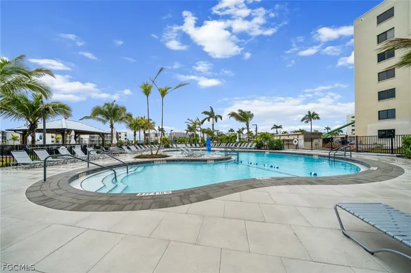 a view of a swimming pool with a terrace