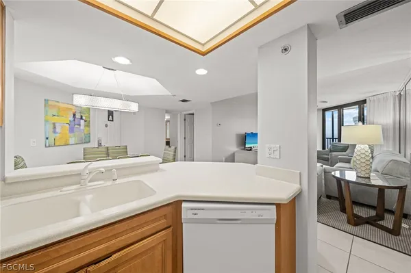 a view of living room with granite countertop furniture and a kitchen view