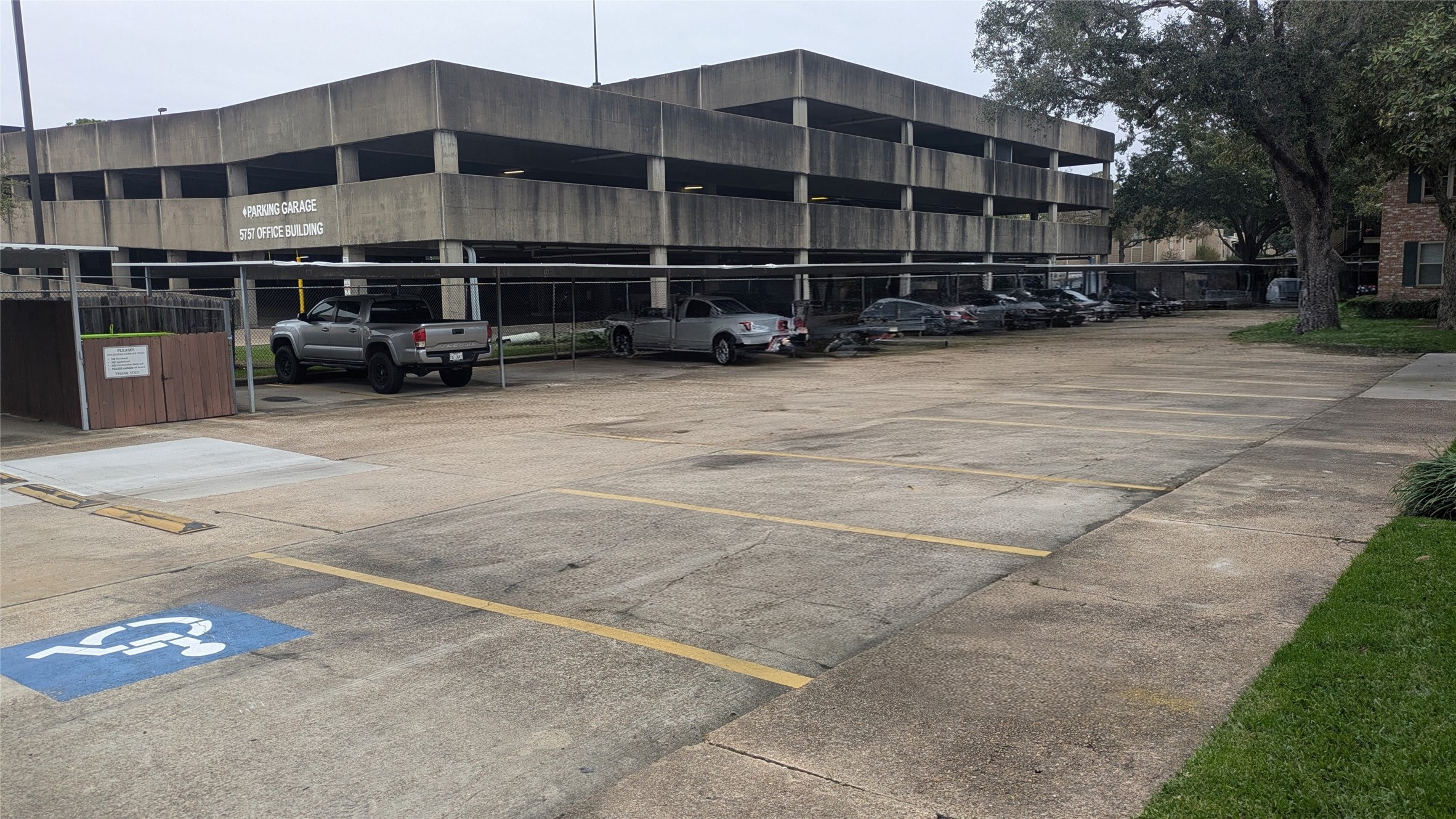 845 Augusta Drive, Unit 17 Houston, TX 77057 - Photo 13 of 19 a view of a building with cars parked in front of it