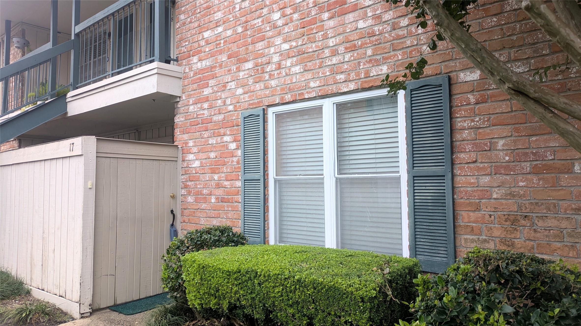 845 Augusta Drive, Unit 17 Houston, TX 77057 - Photo 17 of 19 a view of a house with a yard