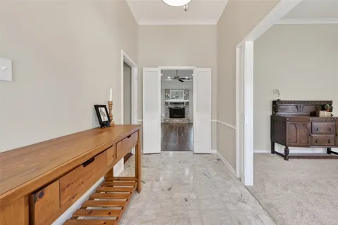 a view of a hallway with seating area