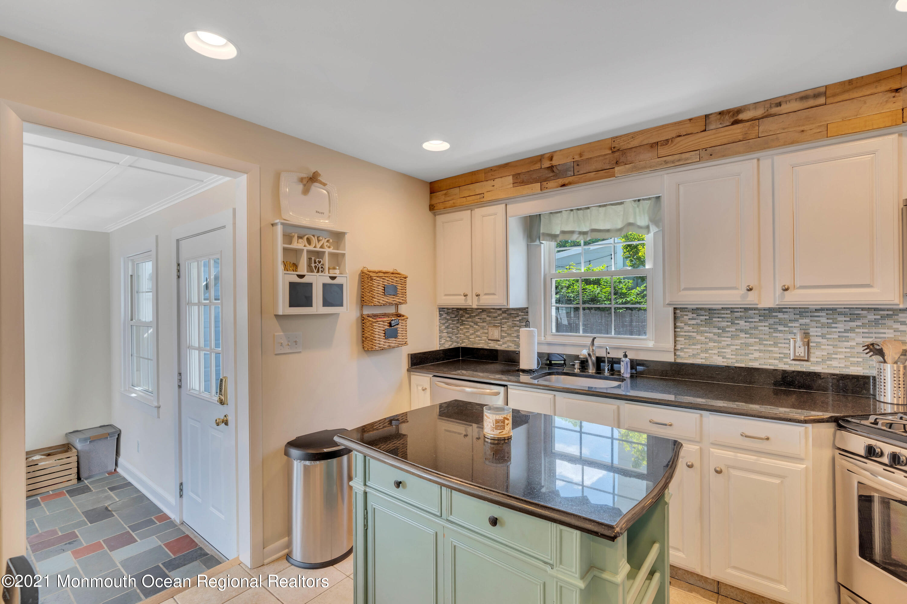 2212 Kenneth Road Point Pleasant, NJ 08742 - Photo 12 of 43 a kitchen with granite countertop a sink a counter space and cabinets