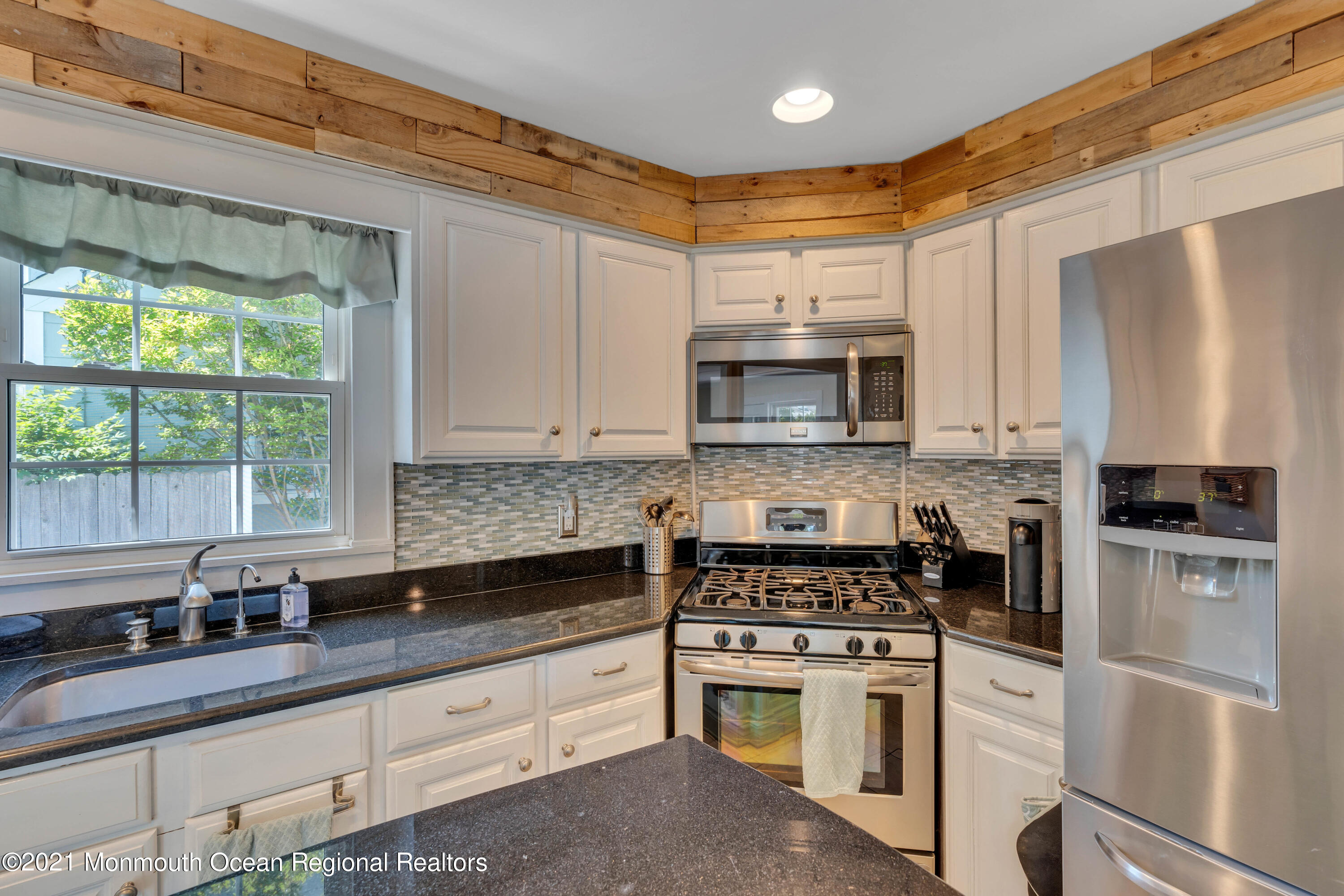 2212 Kenneth Road Point Pleasant, NJ 08742 - Photo 14 of 43 a kitchen with granite countertop a sink stainless steel appliances and cabinets