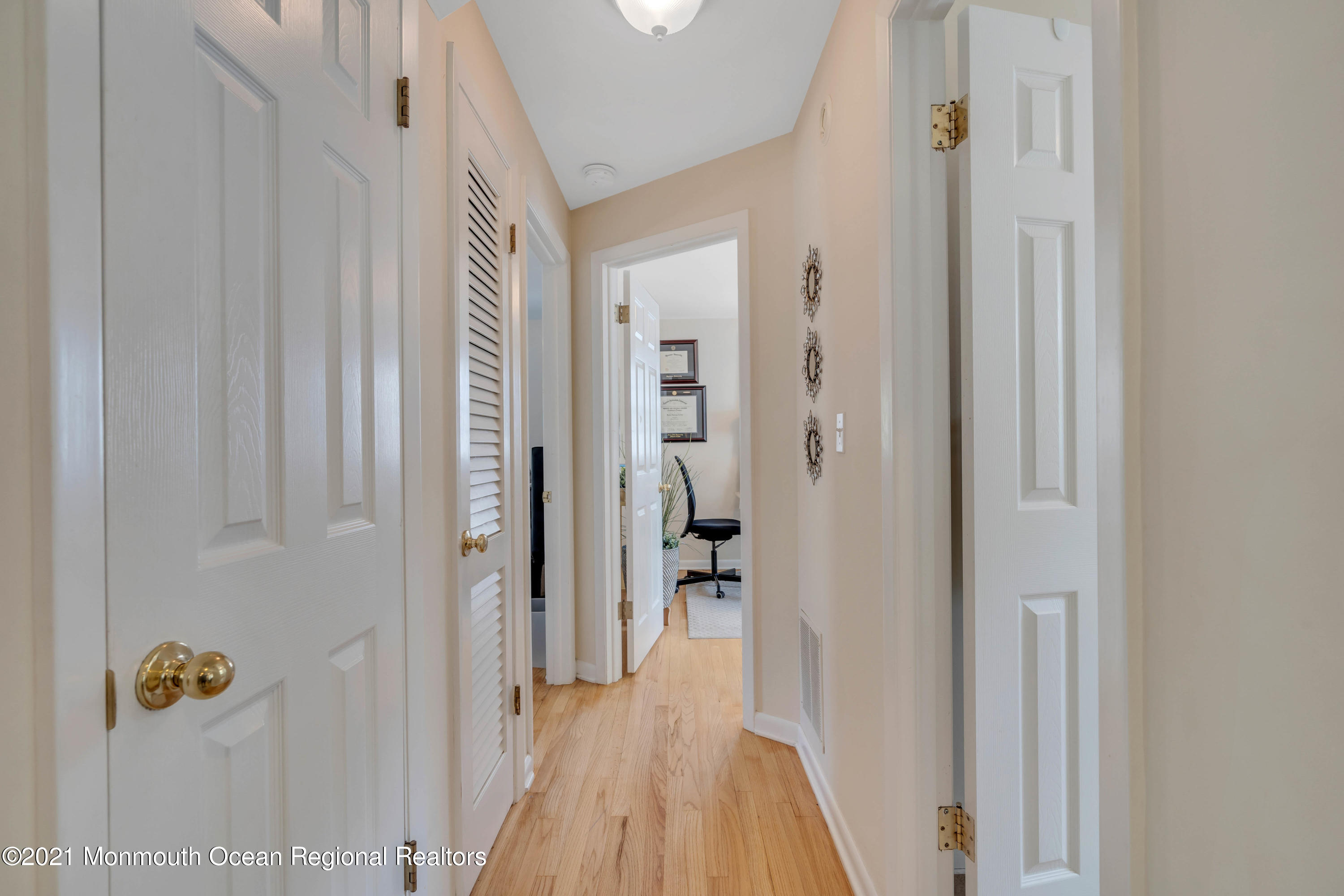 2212 Kenneth Road Point Pleasant, NJ 08742 - Photo 21 of 43 a view of a hallway with wooden floor and closet