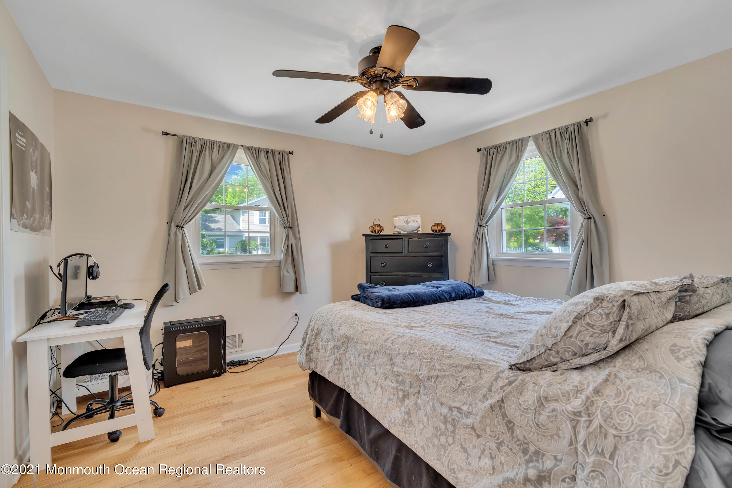 2212 Kenneth Road Point Pleasant, NJ 08742 - Photo 25 of 43 a bedroom with a bed and a flat tv screen on the dresser