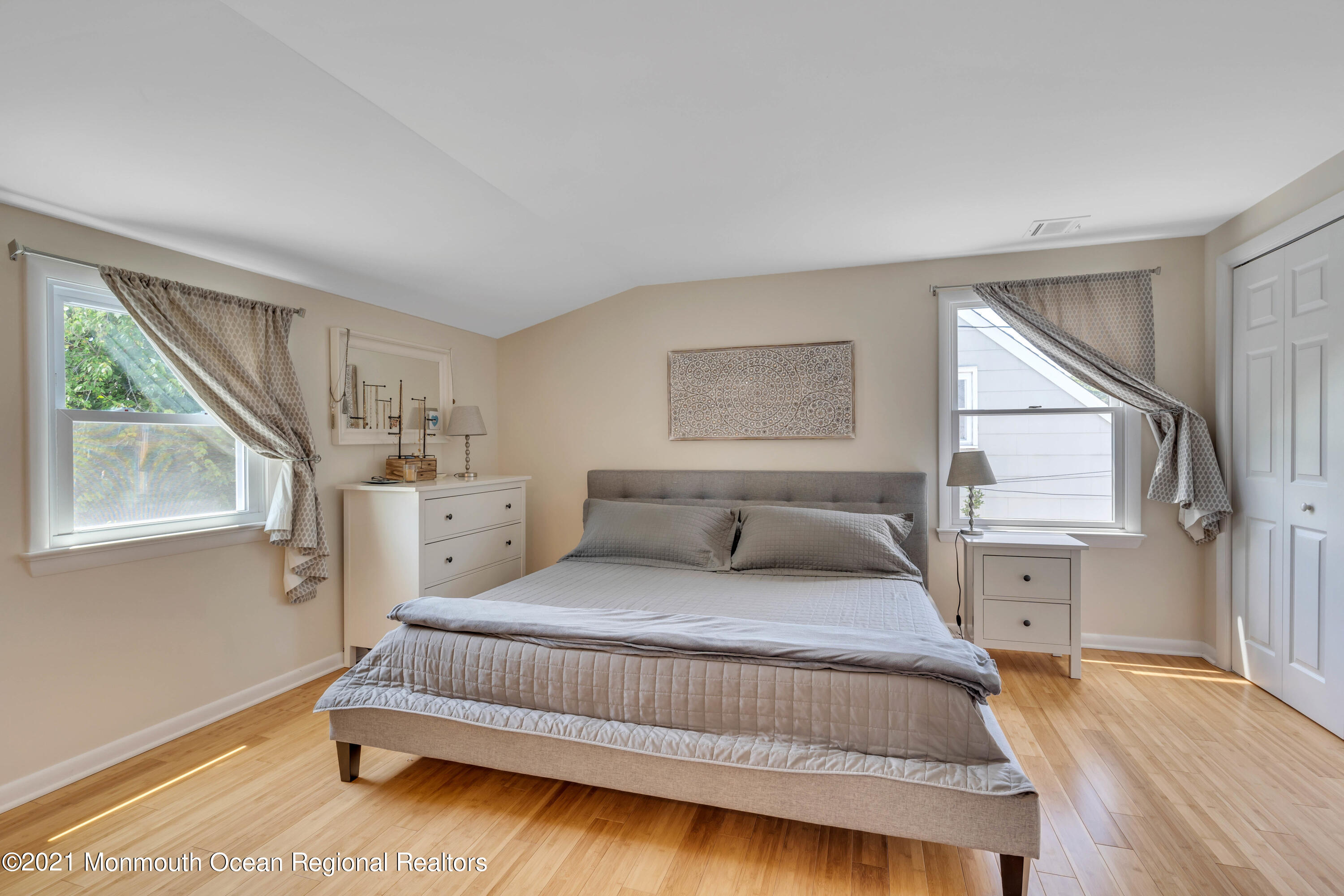 2212 Kenneth Road Point Pleasant, NJ 08742 - Photo 27 of 43 a bedroom with a large bed and a window