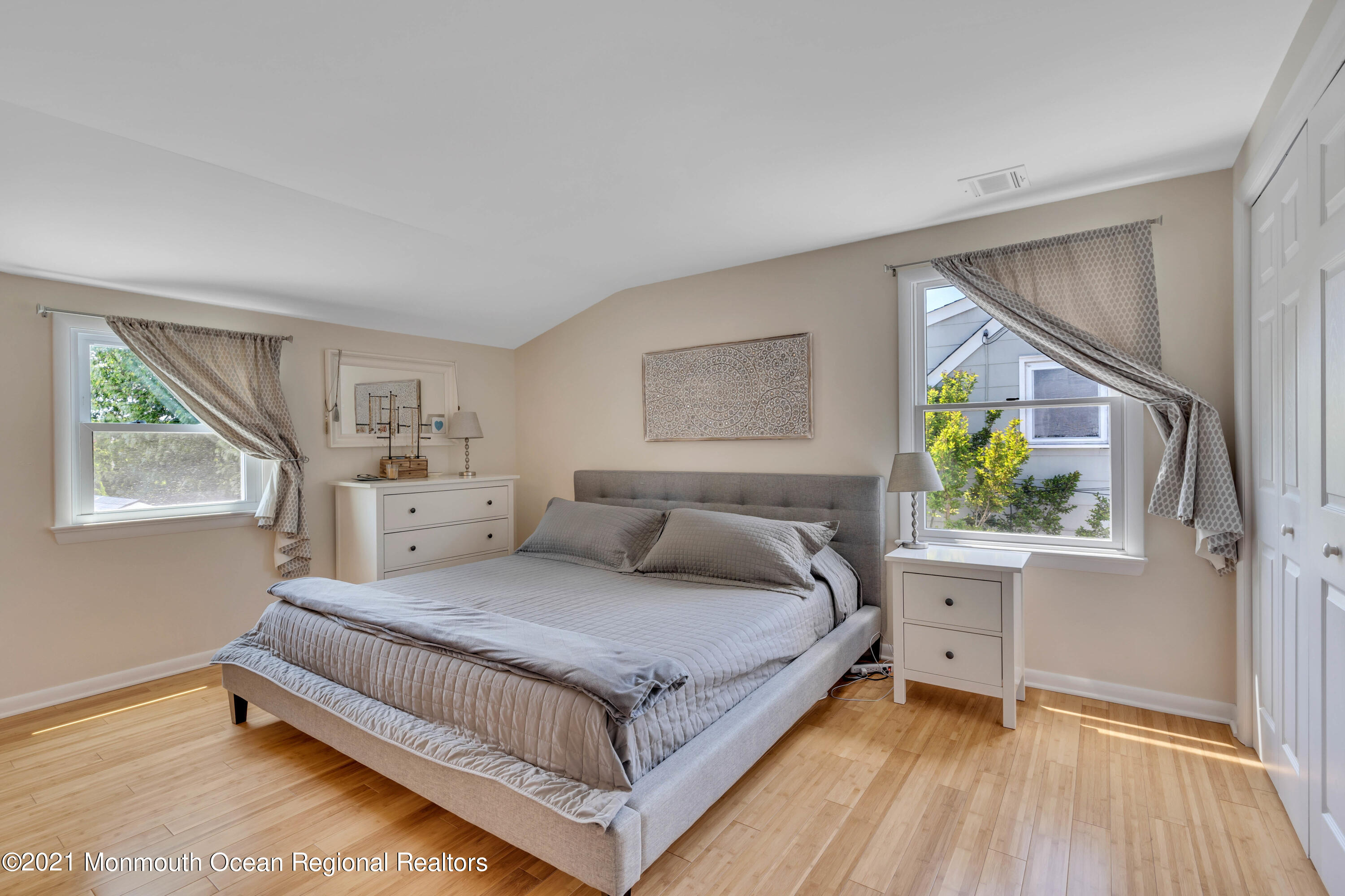2212 Kenneth Road Point Pleasant, NJ 08742 - Photo 28 of 43 a bedroom with a bed and a painting on the wall