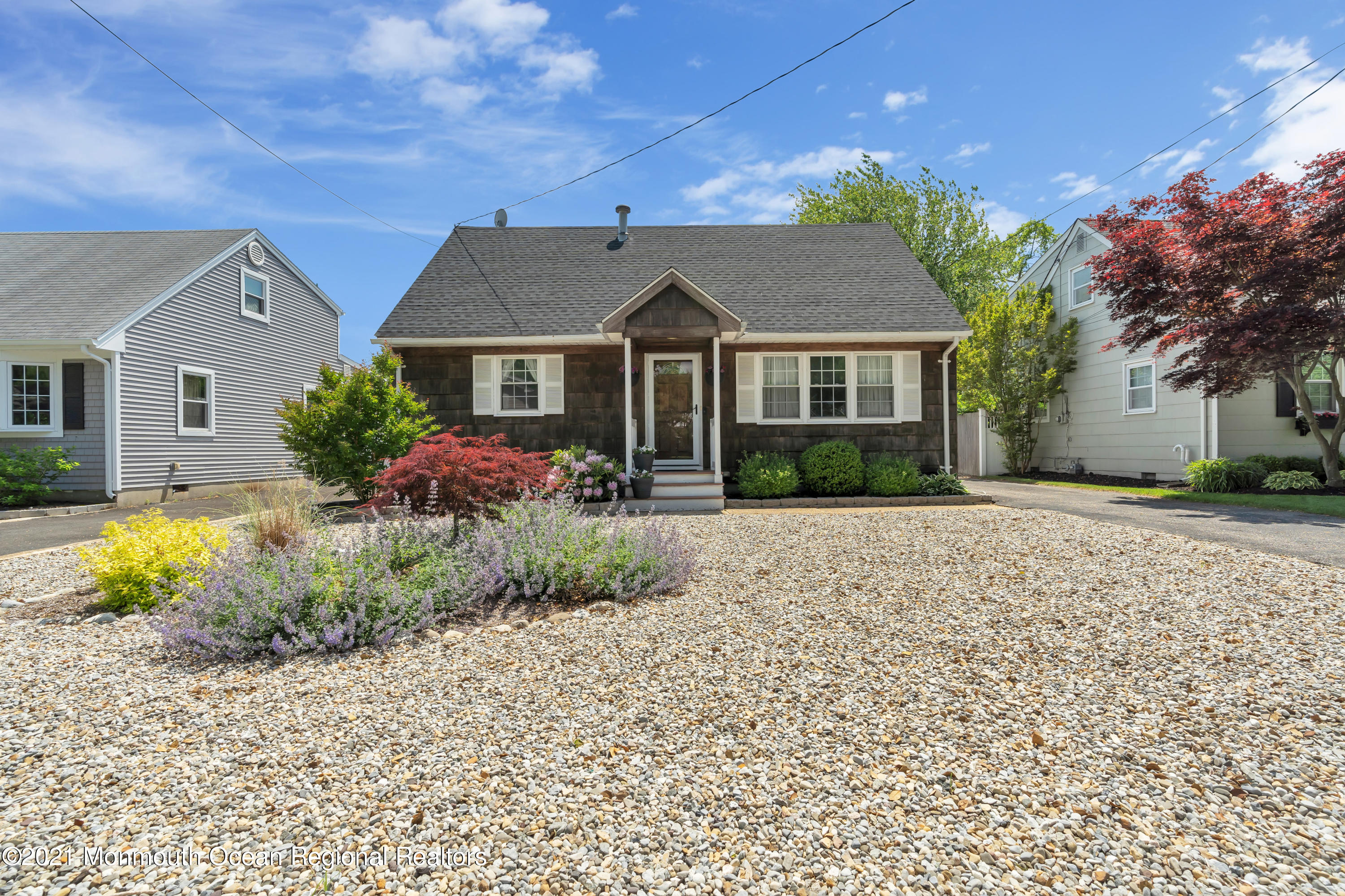 2212 Kenneth Road Point Pleasant, NJ 08742 - Photo 4 of 43 a front view of a house with garden
