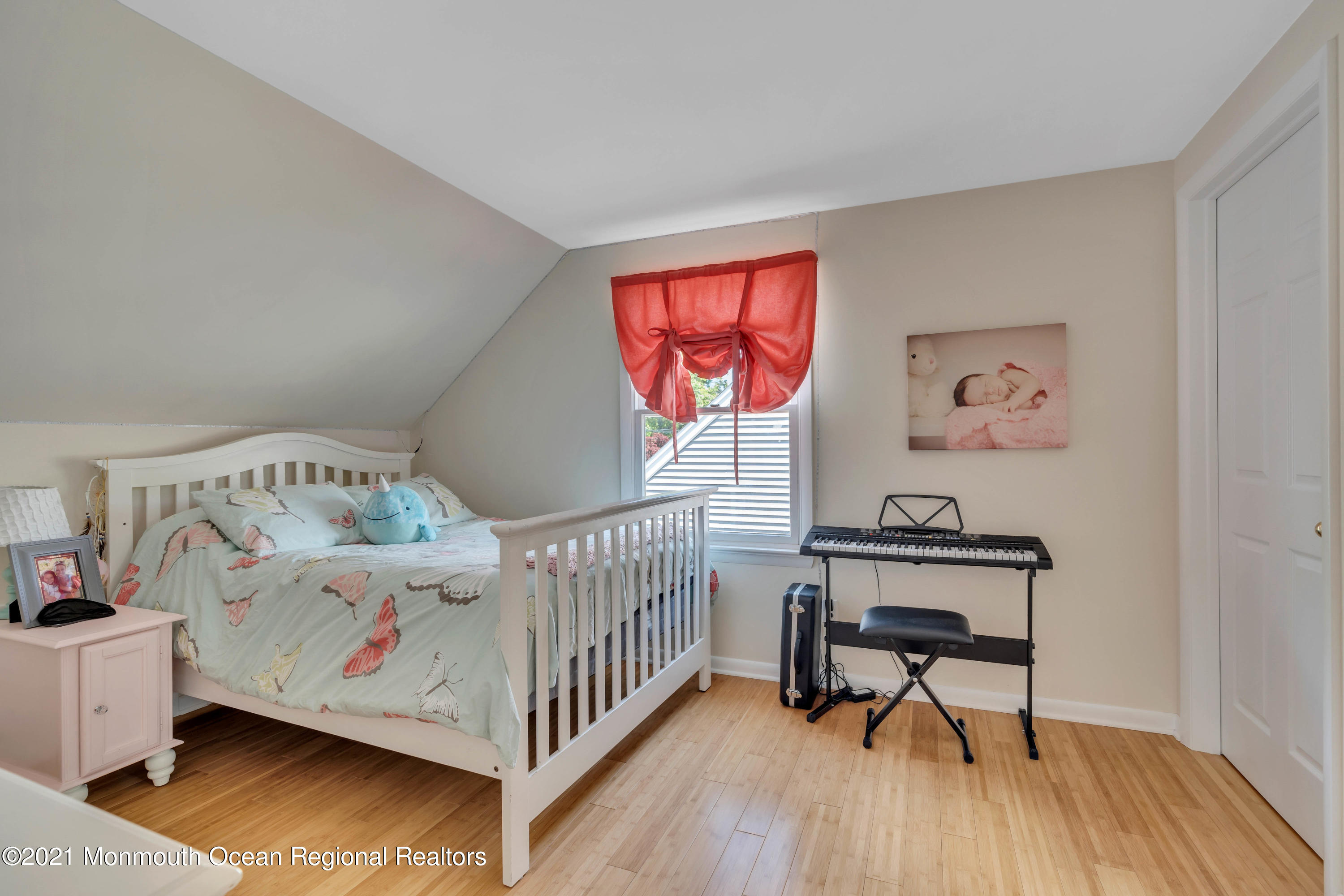 2212 Kenneth Road Point Pleasant, NJ 08742 - Photo 33 of 43 a bedroom with a bed and wooden floor