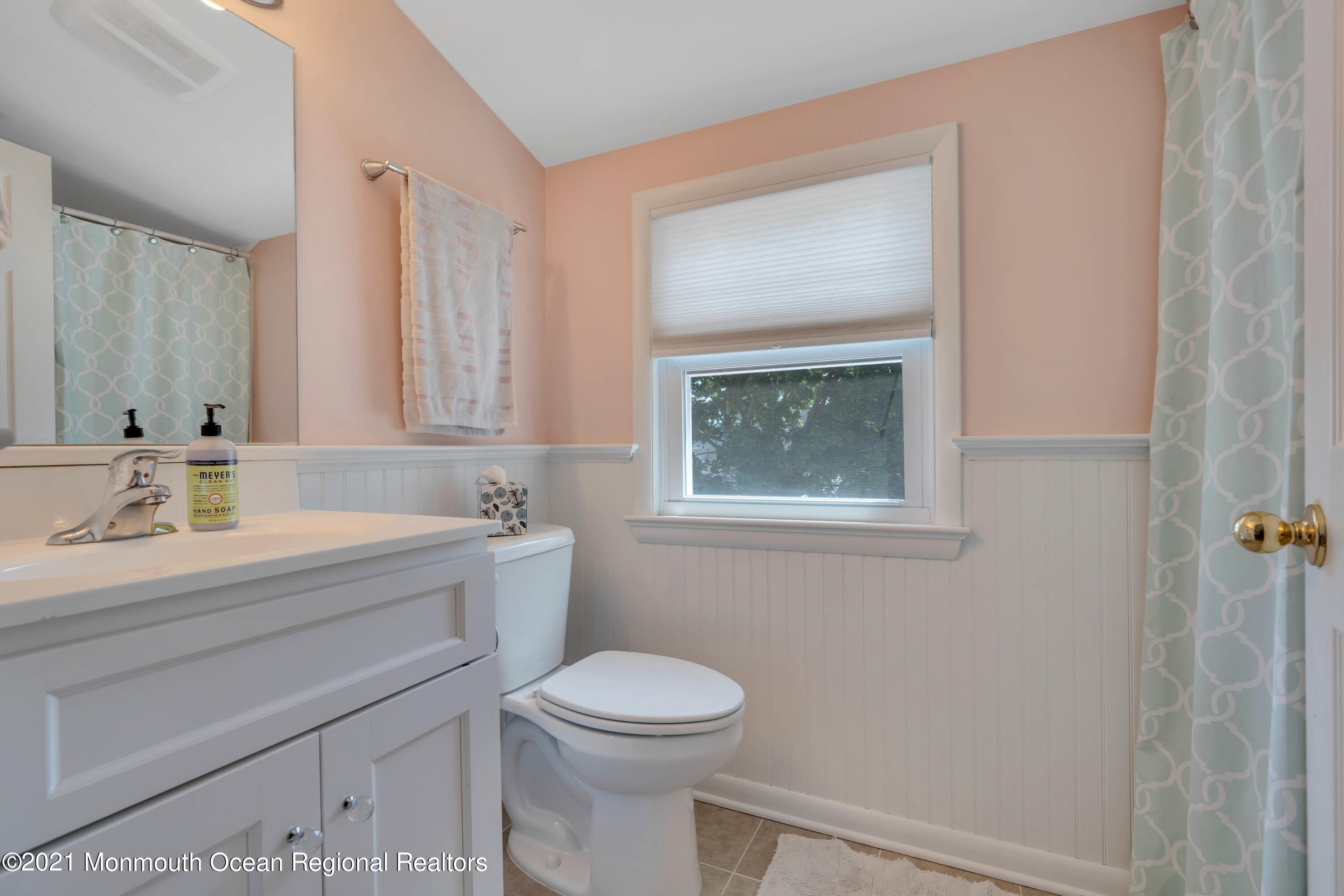 2212 Kenneth Road Point Pleasant, NJ 08742 - Photo 36 of 43 a bathroom with a sink a toilet and a mirror