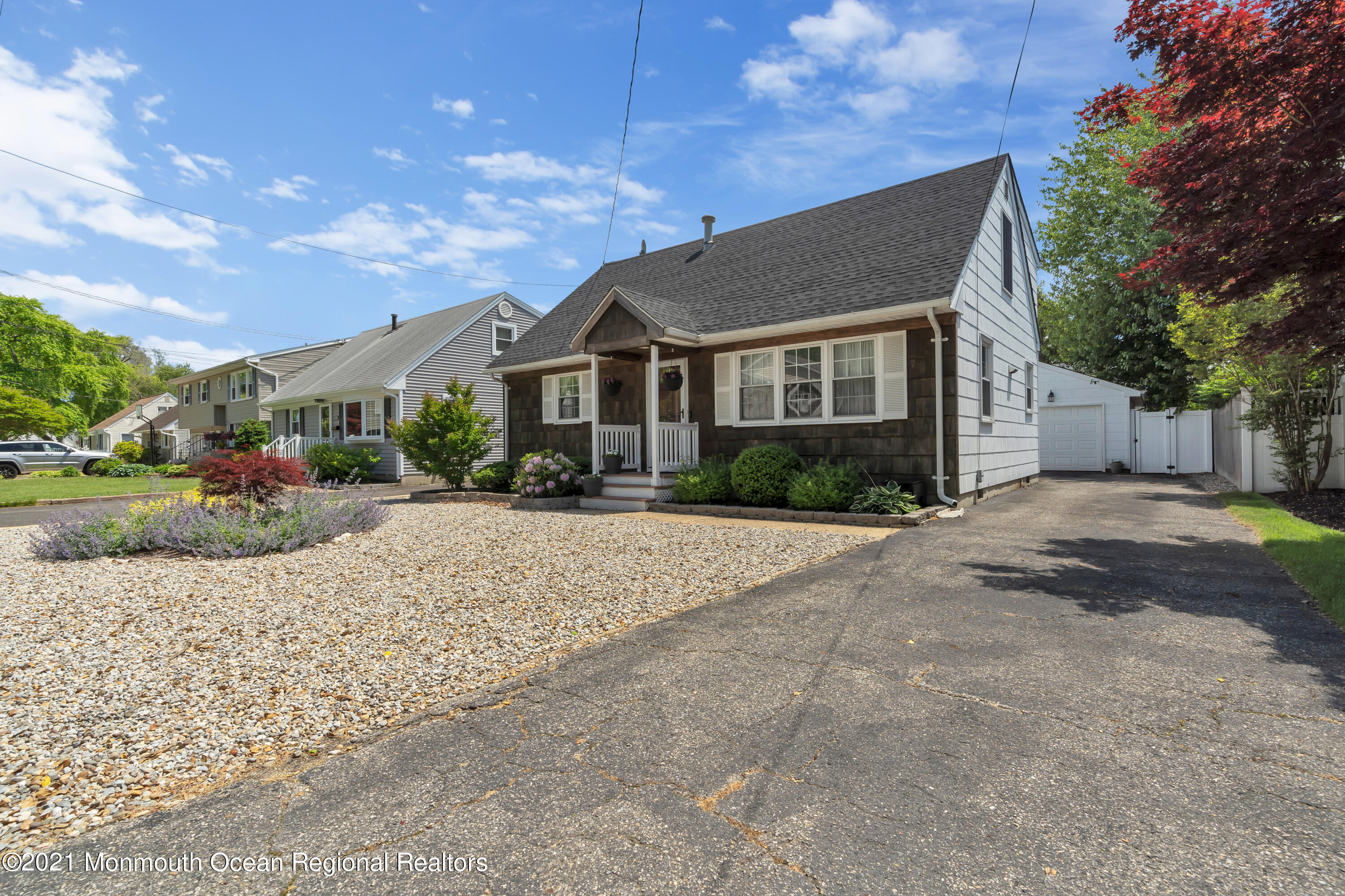 2212 Kenneth Road Point Pleasant, NJ 08742 - Photo 5 of 43 a front view of a house with a yard and potted plants